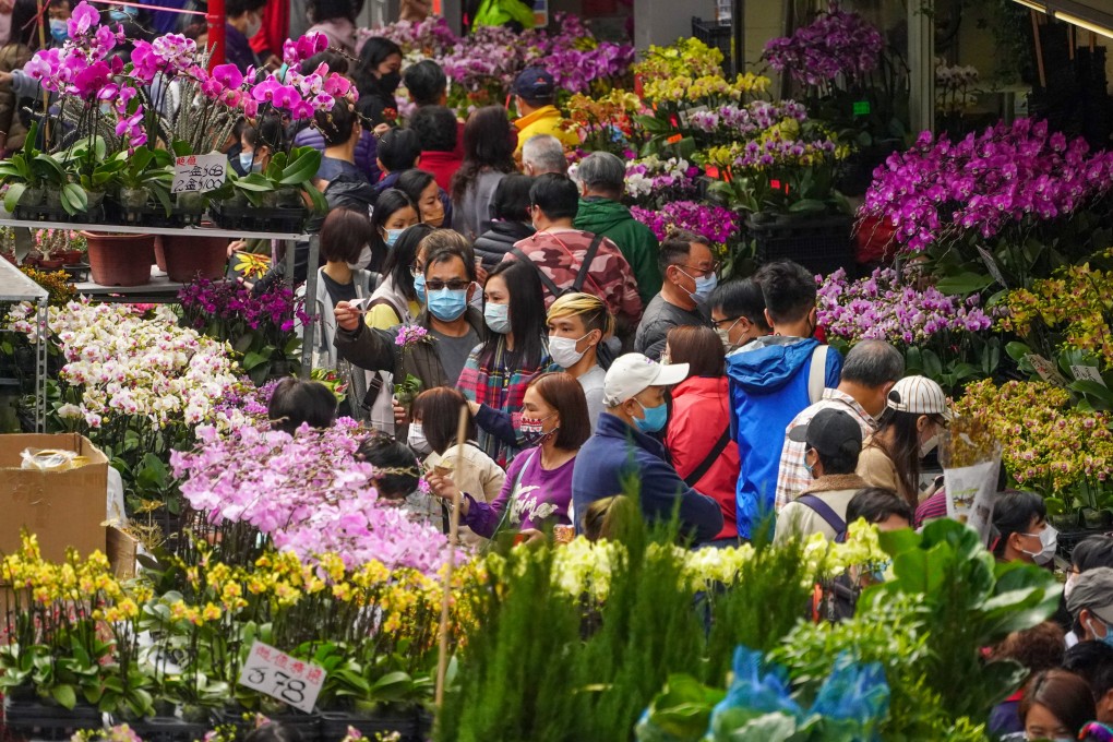 People flock to the Mong Kok Flower Market for Lunar New Year blooms. Photo: Felix Wong