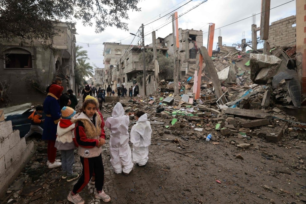 Children gather in front of a building destroyed by Israeli bombing in Rafah in the southern Gaza Strip on Saturday. Photo: AFP