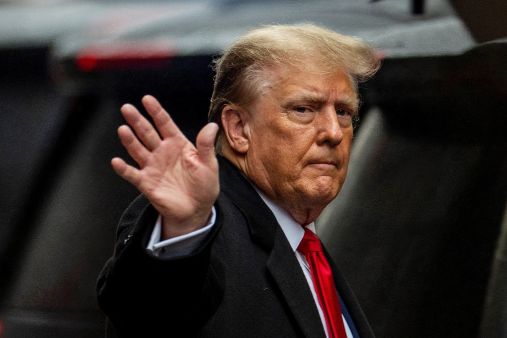 Former US president Donald Trump gestures to his supporters, as he departs for his second civil trial outside a Trump Tower in New York on Friday. Photo: Reuters