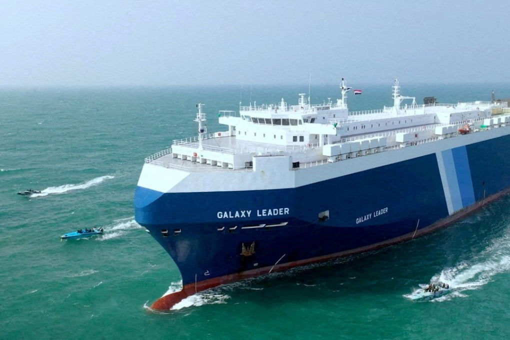 Houthi boats escort the Galaxy Leader cargo ship in the Red Sea in late November. Photo: Houthi Military Media via Reuters