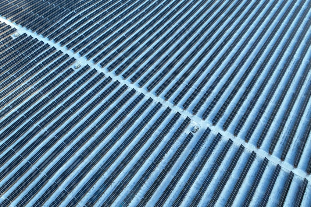 Solar panels are seen in the snow-covered Gobi desert in Yinchuan, in China’s northern Ningxia region, on January 21. China’s efforts to transform its energy market are critical to the global fight against climate change. Photo: AFP