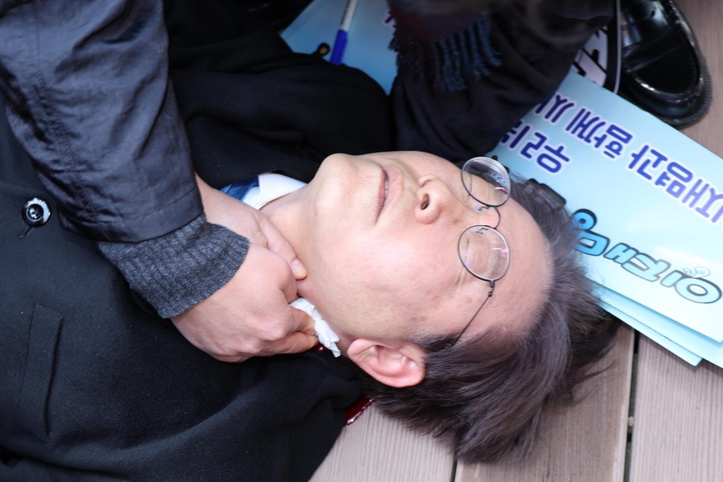 Lee Jae-myung, chief of South Korea’s main opposition Democratic Party, lies on the ground after being stabbed in the neck on January 2. Photo: Newsis via Xinhua