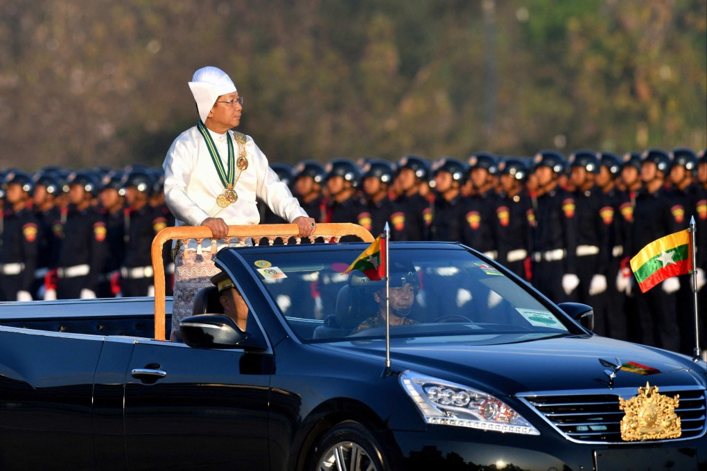Myanmar’s military chief Min Aung Hlaing stands in a car during a parade to mark the country’s Independence Day on January 4, 2023. Photo: AFP