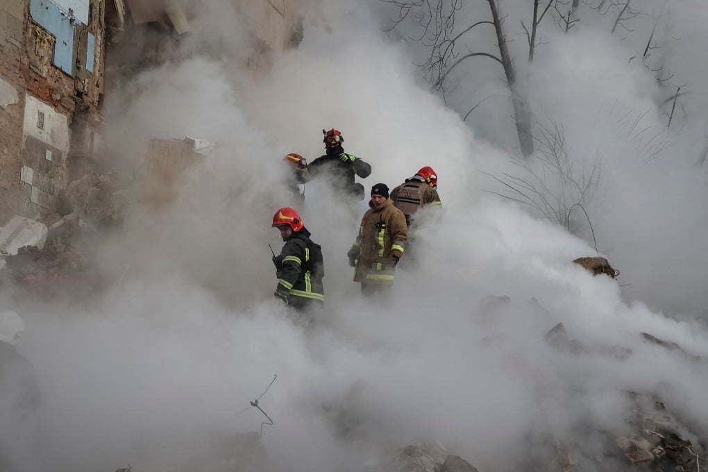 Rescuers at a residential building in Kharkiv, Ukraine, following a Russian missile attack. Photo: Reuters