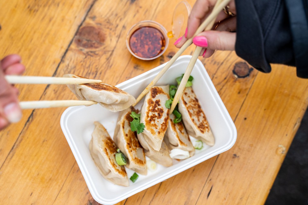 Chubby Dumpling customers tuck into
a serving of dumplings in London. Its menu includes vegan dumplings, which former graphic designer Chantel Yeung and her Hong Kong-born chef father came up with to satisfy the palates of the many Londoners who follow plant-based diets. Photo: Chubby Dumpling