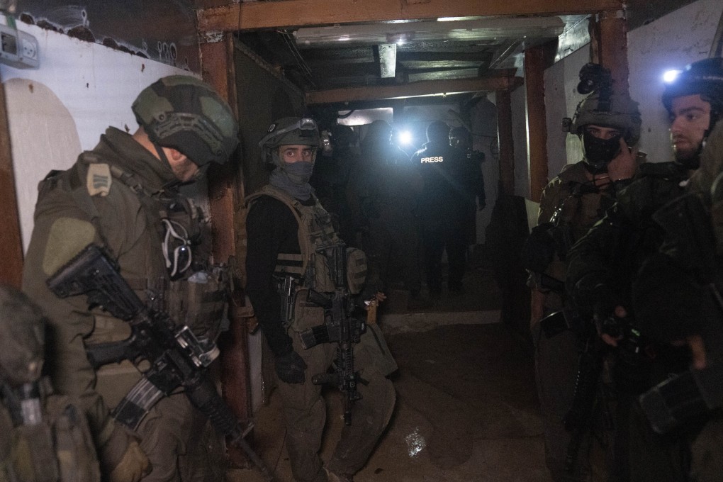 Israeli soldiers in a Hamas tunnel underneath a cemetery in Khan Younis, southern Gaza. Photo: AP