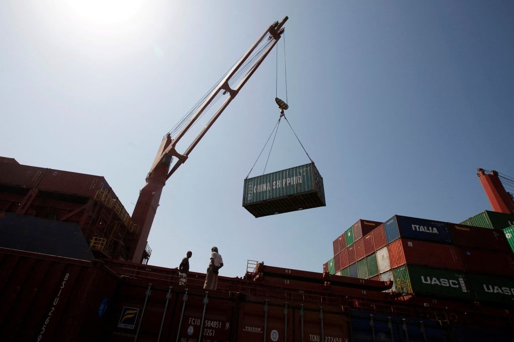 Workers look on as containers are unloaded at the Red Sea port of Hodeidah in Yemen. The Red Sea shipping crisis is sending waves through Asia’s fuel markets, hoisting costs even on routes that don’t use the waterway. Photo: Reuters