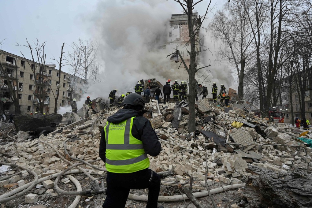 Ukrainian rescue workers clear debris at the site of a missile attack in Kharkiv on January 23. Photo: AFP