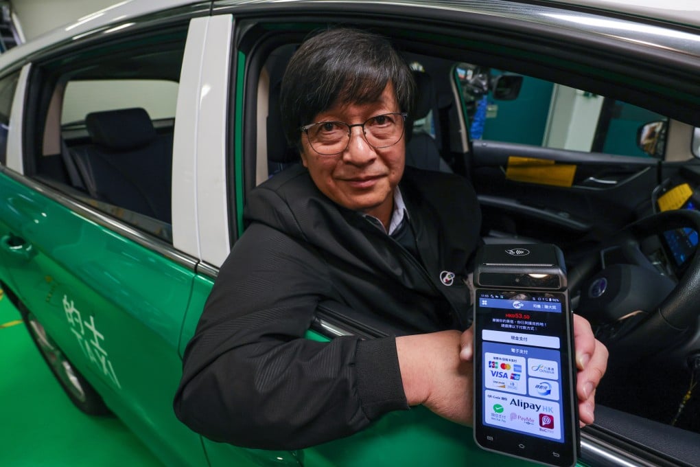 Wong Yu-ting, managing director of CabCab and chairman of the Hong Kong Tele-call Taxi Association, shows how the smart taxi meter works. Photo: May Tse