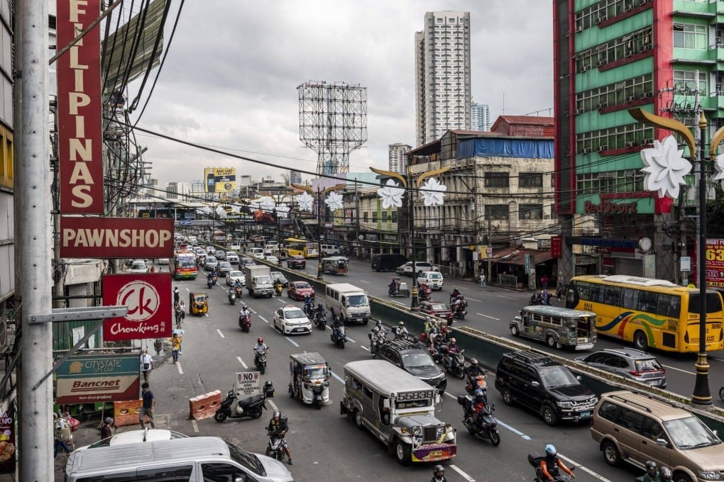 Vehicles travel along a road in Manila earlier this month. Gross domestic product expanded 5.6 per cent in the Philippines last year. Photo: Bloomberg