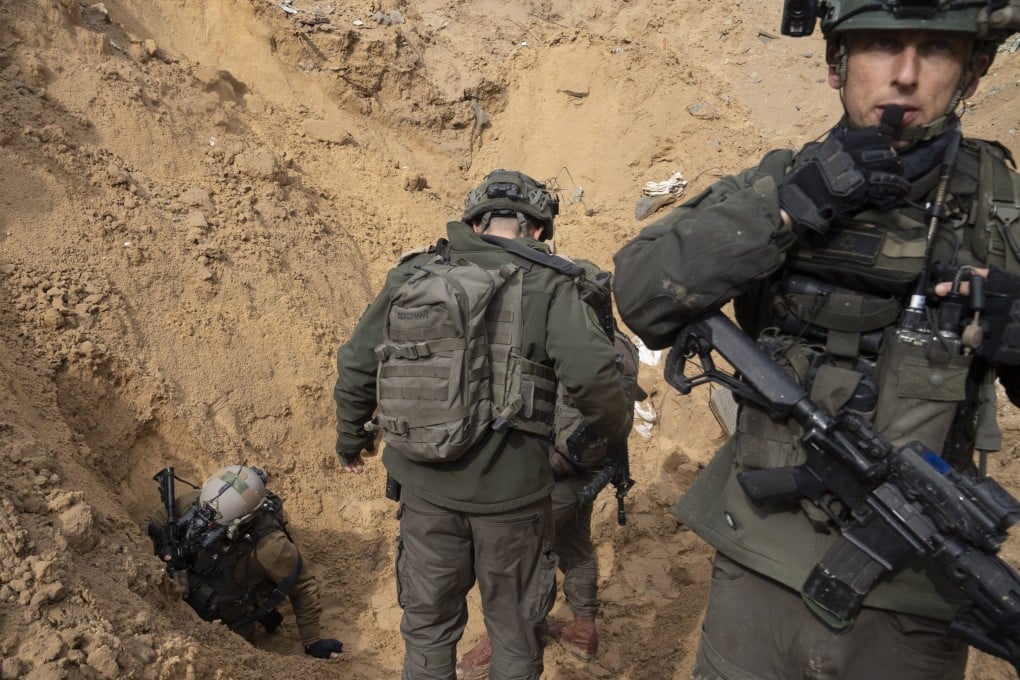 Israeli soldiers enter a Hamas tunnel underneath a cemetery during the ground offensive on the Gaza Strip in Khan Younis. Photo: AP