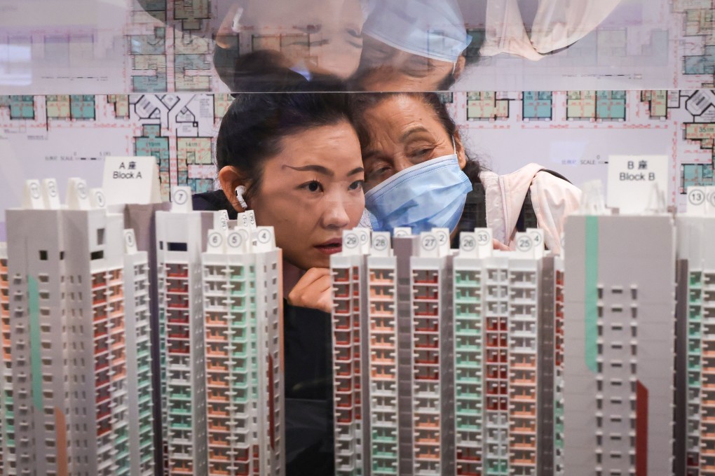 Potential buyers examine models of Housing Authority subsidised homes for sale. Photo: May Tse