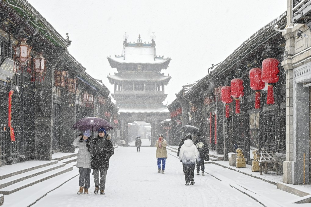 Tourists visit Pingyao, an ancient walled city in northern China’s Shanxi province on December 14. China can broaden its appeal through tourism, cultural heritage and hospitality. Photo: Xinhua