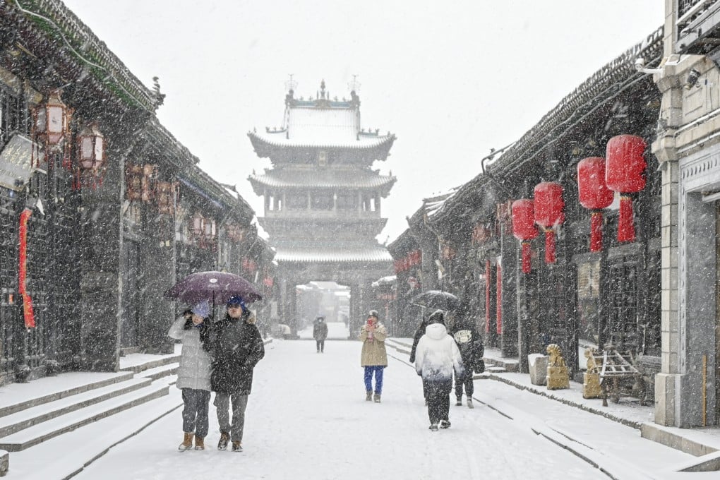 Tourists visit Pingyao, an ancient walled city in northern China’s Shanxi province on December 14. China can broaden its appeal through tourism, cultural heritage and hospitality. Photo: Xinhua