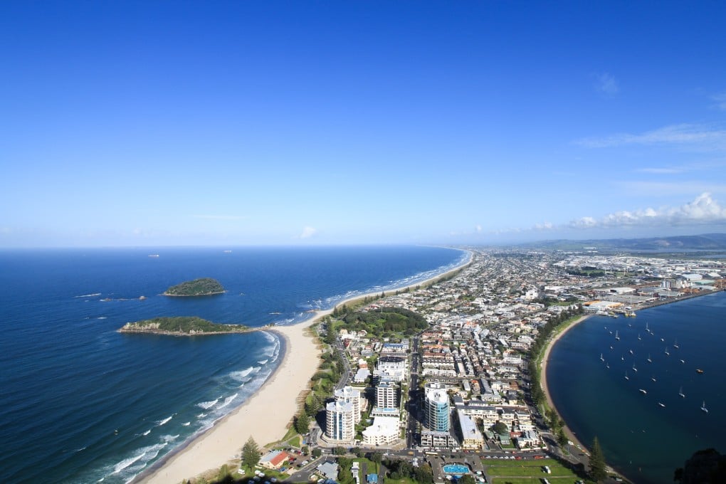 Tauranga and beaches viewed from Mount Maunganui in New Zealand. Tauranga is the capital of the Bay of Plenty, a region whose attractions include its hiking trails, a wildlife sanctuary, and restaurants that champion local produce. Photo: Getty Images