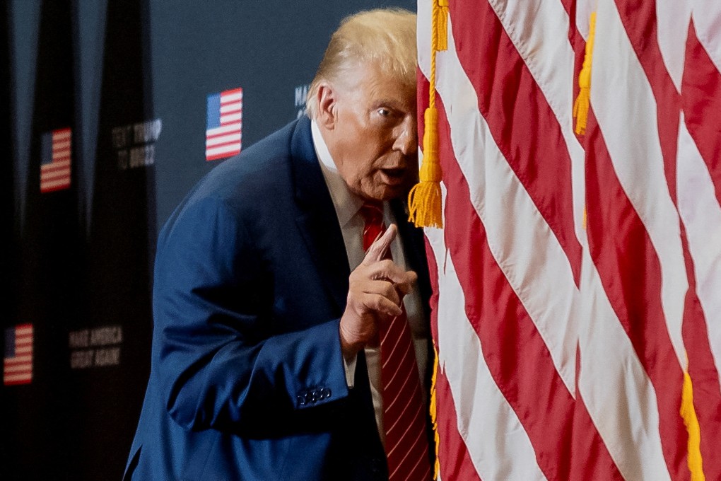Donald Trump acts confused on stage as he impersonates US President Joe Biden during a campaign event in Iowa on January 6. Photo: Reuters