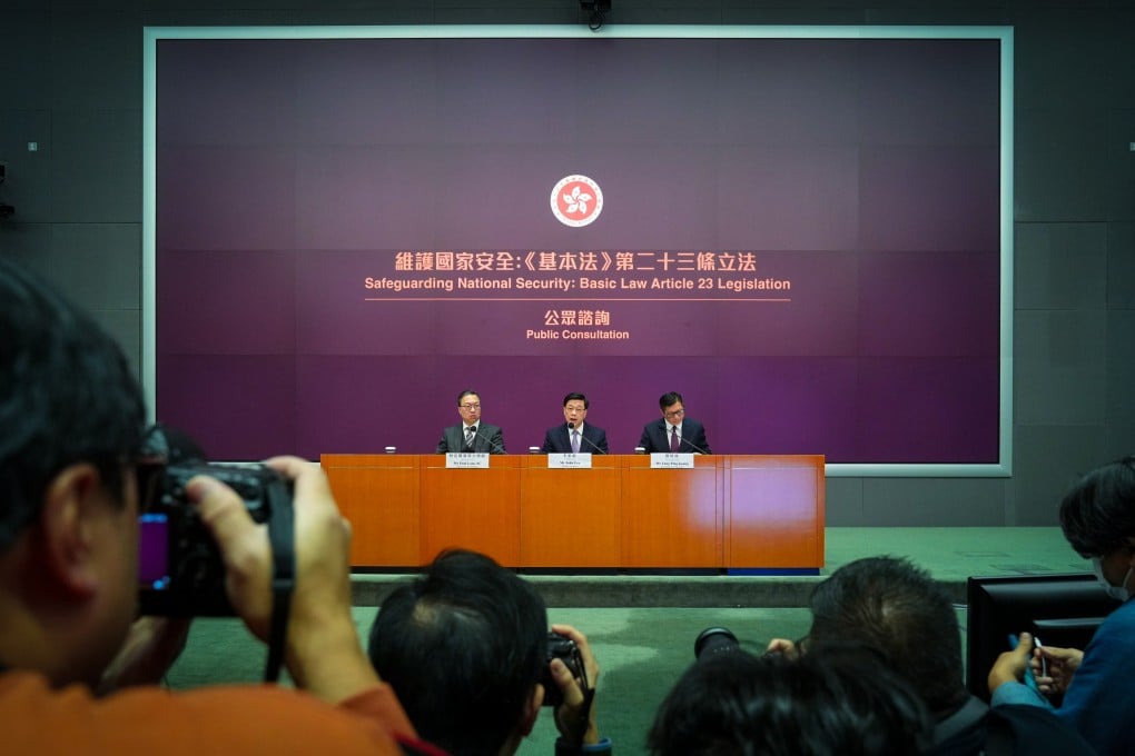 Hong Kong’s Secretary for Justice Paul Lam (left), Chief Executive John Lee and security minster Chris Tang announce the Article 23 consultation. Photo: Sam Tsang