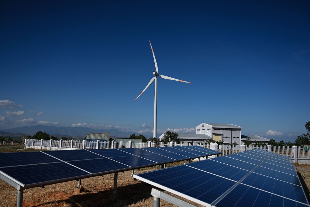 Solar panels and a wind turbine at a farm in Vietnam’s Binh Thuan province. Photo: AFP