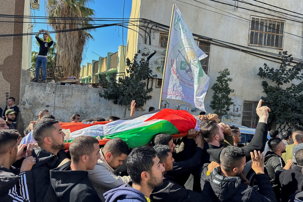 Palestinian mourners carry the body of 38-year-old Ahmad Assi, who was killed in a settler raid in the Israeli-occupied West Bank in December. Photo: Reuters