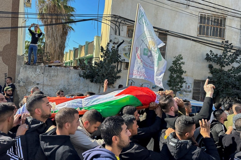 Palestinian mourners carry the body of 38-year-old Ahmad Assi, who was killed in a settler raid in the Israeli-occupied West Bank in December. Photo: Reuters