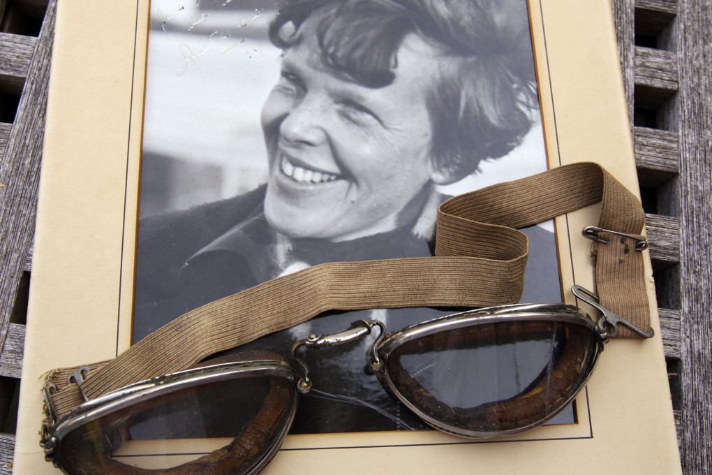 A photo of Amelia Earhart dated 1937, along with goggles she was wearing during her first plane crash. A fuzzy sonar image has ignited hopes of finding her missing plane almost nine decades after it disappeared. Photo: AP/File