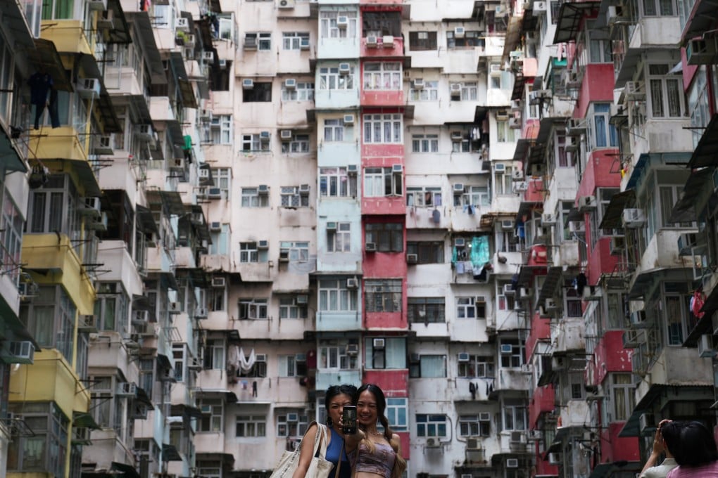 Tourists take photos at Montane Mansion, also known as the “Monster Building”, in Quarry Bay in 2023. The popularity of the building, which was featured in a Transformers movie, is just one example of changing tourist tastes. Photo: Sam Tsang