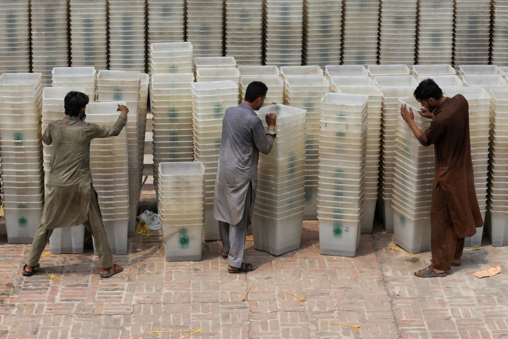Workers sort out ballot boxes before dispatching them to polling stations ahead of Pakistan’s general election in 2018. Photo: Reuters