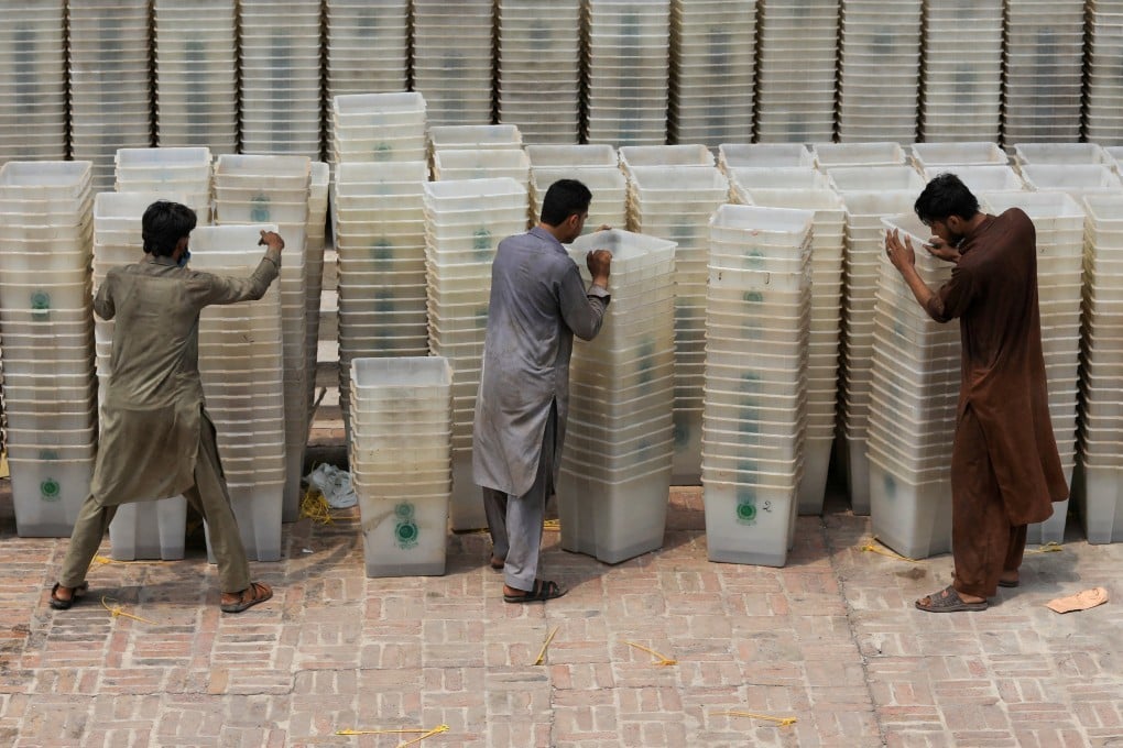 Workers sort out ballot boxes before dispatching them to polling stations ahead of Pakistan’s general election in 2018. Photo: Reuters
