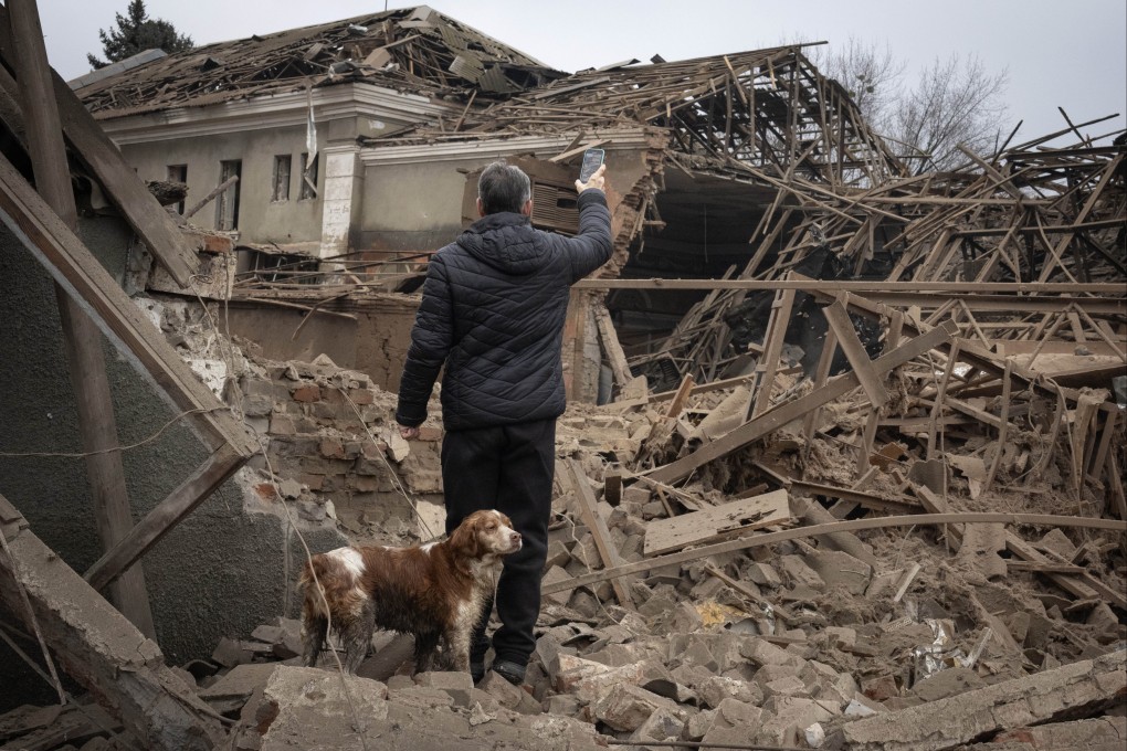 A resident looks at damaged buildings after a Russian rocket attack in Sloviansk, Ukraine, in January. Photo: AP