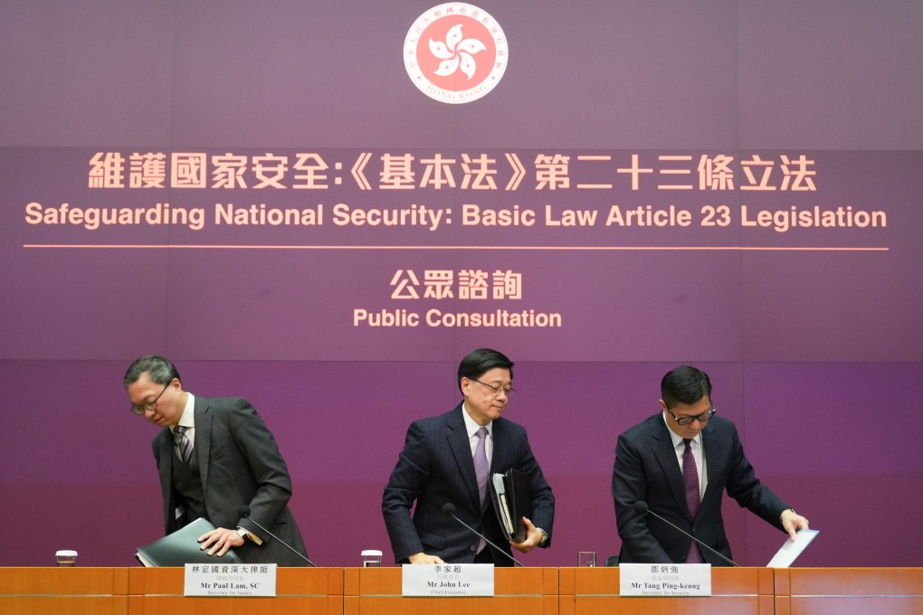 Secretary for Justice Paul Lam (left), Chief Executive John Lee (middle) and Secretary for Security Chris Tang at a press conference on the Article 23 legislation on Tuesday. Photo: Sam Tsang