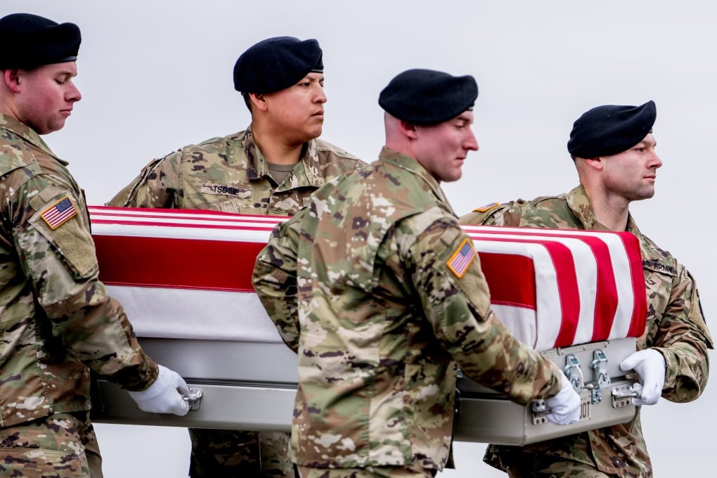 The US Army Old Guard Carry Team conducts a transfer of the bodies of three US service members at Dover Air Force Base in Delaware on Friday. Photo: dpa