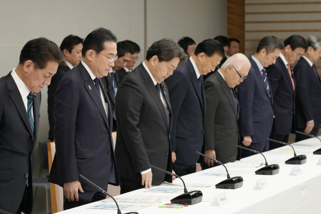 Japanese Prime Minister Fumio Kishida (2nd from left) and other officials offer a silent prayer during the inaugural meeting of a government task force on rebuilding central Japan areas damaged by the New Year’s Day earthquake. The approval rating of the Kishida cabinet hit an all-time low in December last year at 22.3 per cent. Photo: Kyodo