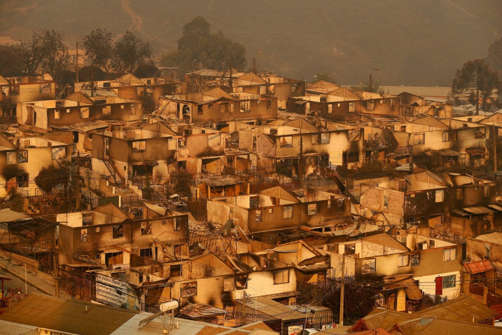 Burnt houses in Vina del Mar, Chile. The number of dead and injured is expected to rise significantly. Photo: Reuters