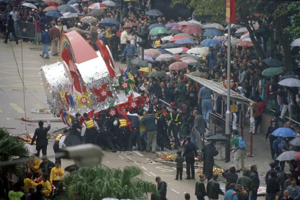 Police and bystanders try to free victims trapped after a Lunar New Year parade float ran into the crowd in Tsim Sha Tsui, Hong Kong, on February 7, 1997. The driver was apparently overcome by carbon monoxide. A British tourist was killed and dozens of people injured. Photo: Dustin Shum