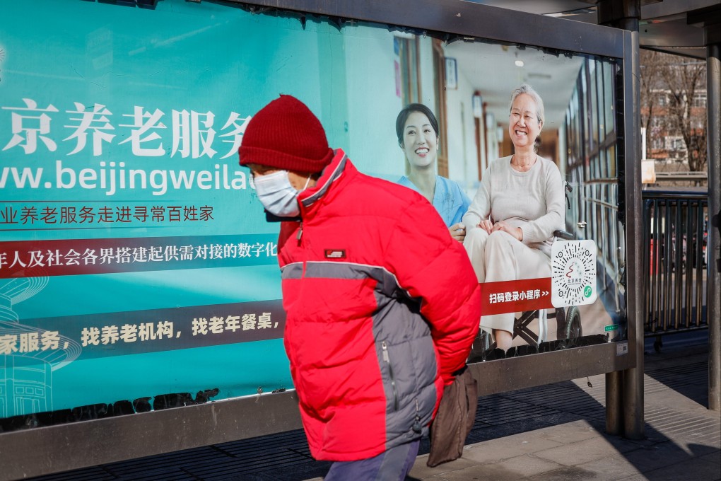 A man walks past an advertisement promoting elderly services in Beijing on January 22. Given the fast pace of life and families often living apart, the centuries-old Chinese practice of family-based senior care has become increasingly untenable. Photo: EPA-EFE