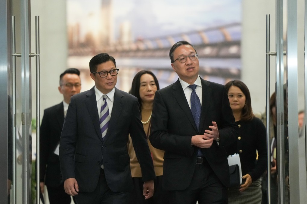 (From left) Secretary for Security Chris Tang and Secretary for Justice Paul Lam meet the media about Article 23 at Tamar on Tuesday. Photo: Sam Tsang