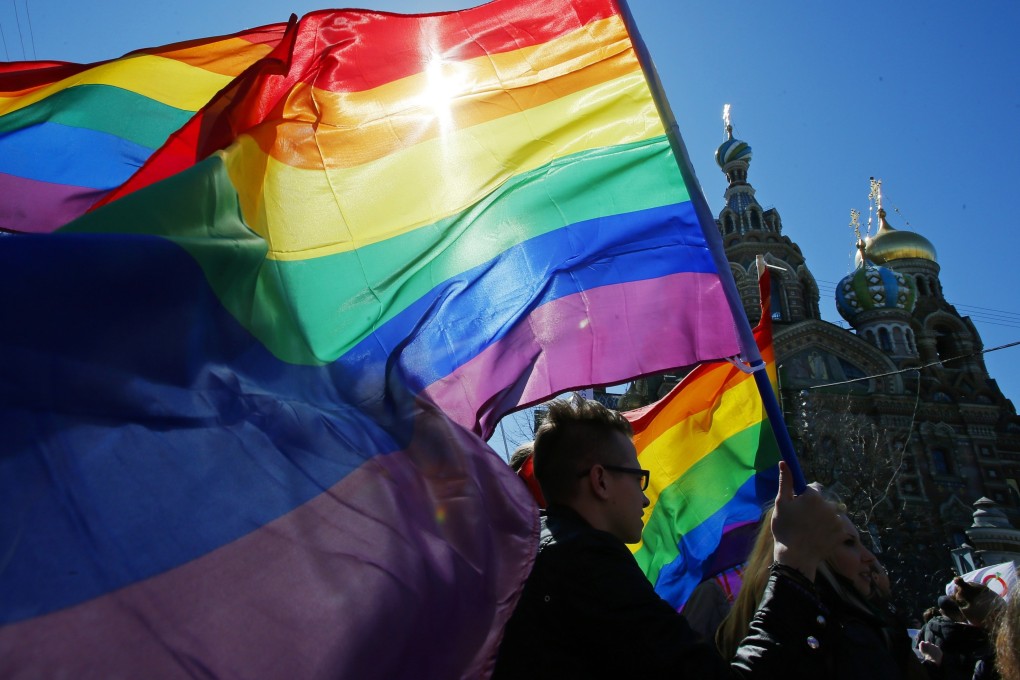 Activists carry rainbow flags in St Petersburg, Russia in 2013. Russia’s Supreme Court effectively outlawed LGBTQ activism in November. Photo: AP