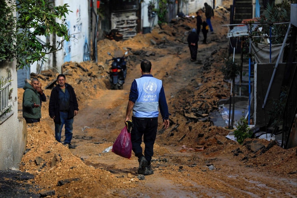 An aid worker wearing a UNWRA jacket in Jenin, in the occupied West Bank. Photo: AFP