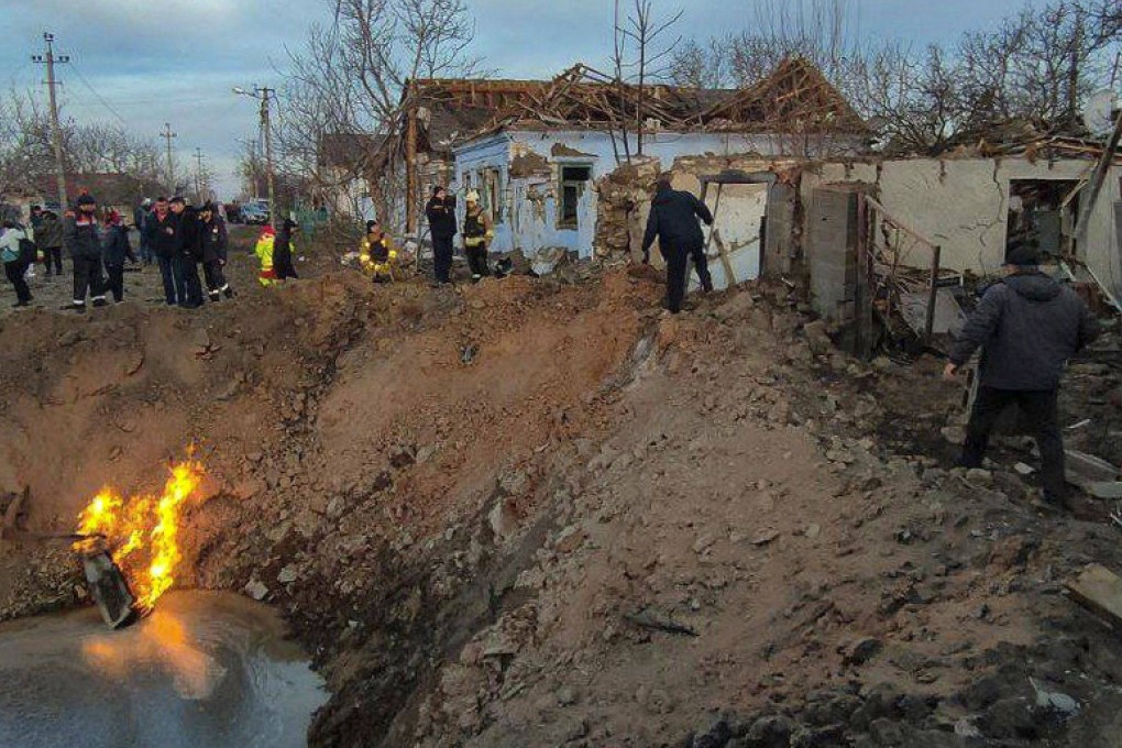 Rscuers work next to a crater following a missile attack in Mykolaiv, amid the Russian invasion of Ukraine. Photo: Handout/Ukrainian Emergency Service/AFP