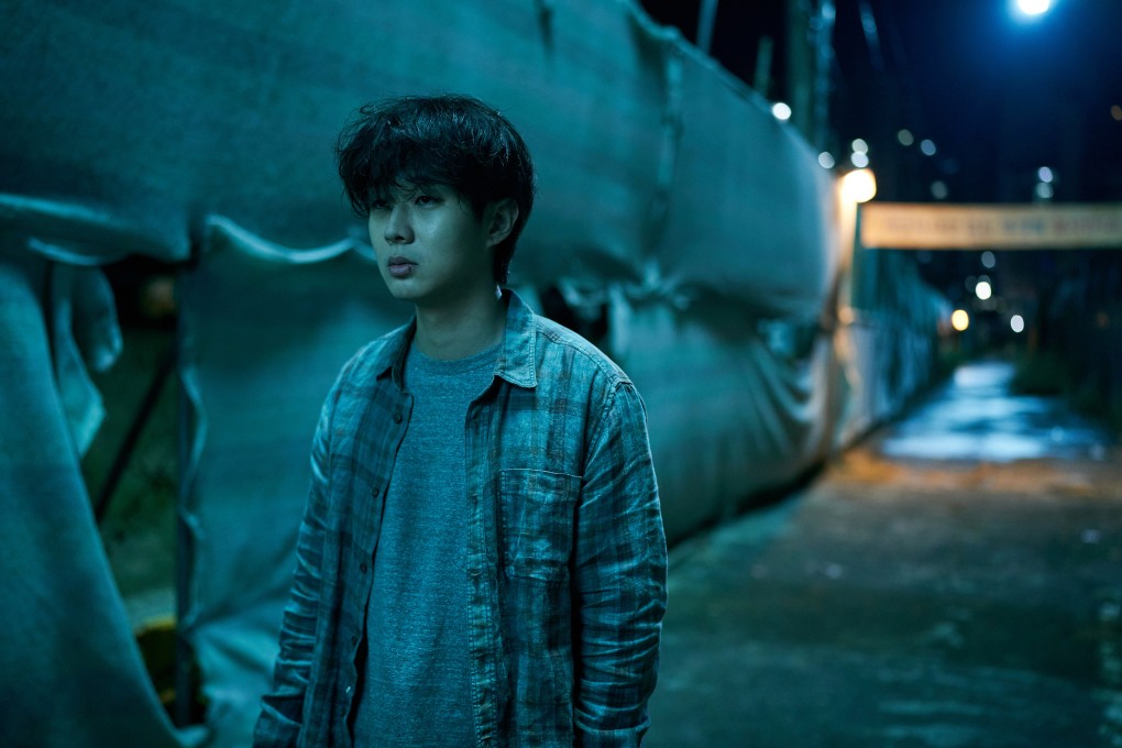 Choi Woo-shik as Lee Tang in a still from A Killer Paradox. Son Suk-ku and Lee Hee-joon co-star. Photo: Song Kyoung Sub/Netflix