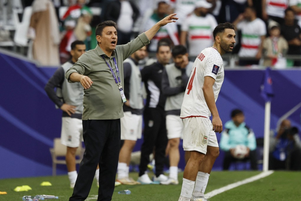 Iran coach Amir Ghalenoei shouts directions to his players during their quarter-final win over Japan. Photo: Reuters