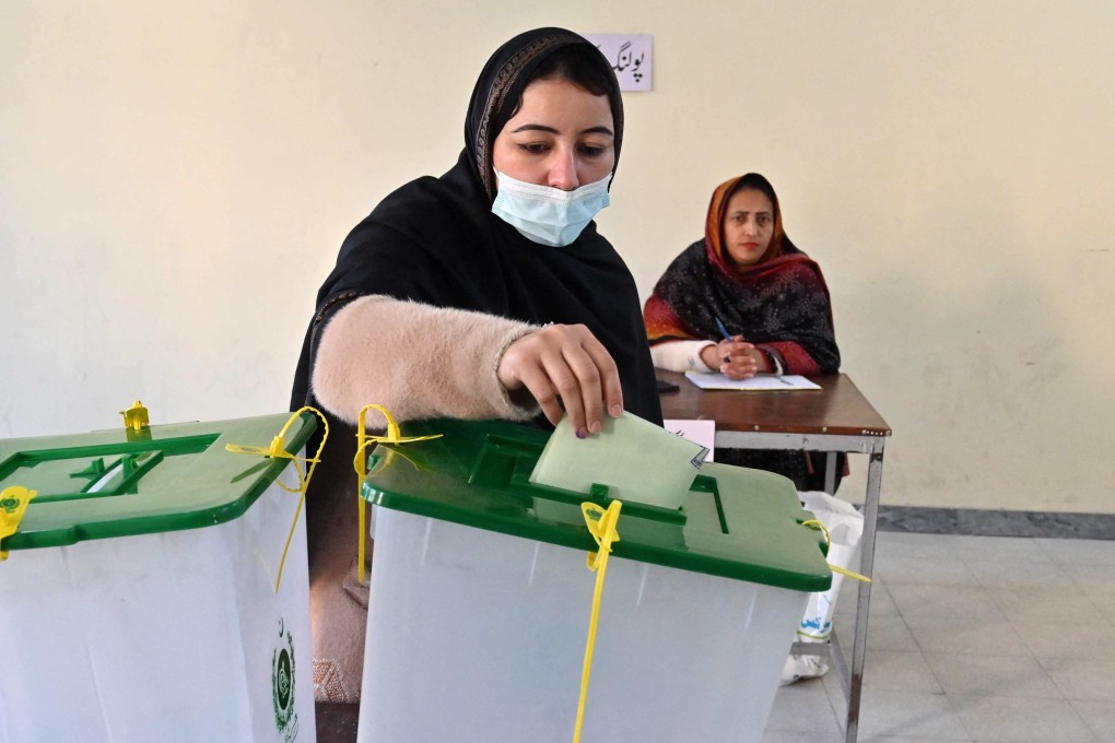 A woman casts her ballot at a polling station in Islamabad on Thursday during Pakistan’s national elections. Photo: AFP