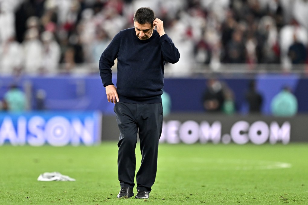 Iran head coach Amir Ghalenoei walks off the pitch after his side’s semi-final defeat to Qatar. Photo: EPA-EFE