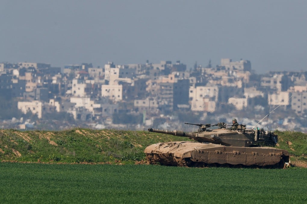 An Israeli tank manoeuvres along the northern Gaza Strip border, as seen from Israel. Photo: Reuters