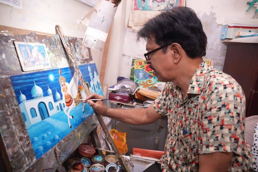 A rickshaw artist at work. Many third or fourth generation rickshaw artists are losing interest in the craft that provides little recognition or income. Photo: Armin Hossen