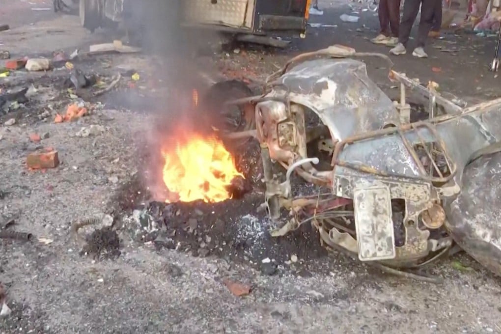 A vehicle burns on Friday following protests in Haldwani in India’s northern state of Uttarakhand. Photo: Handout via Reuters