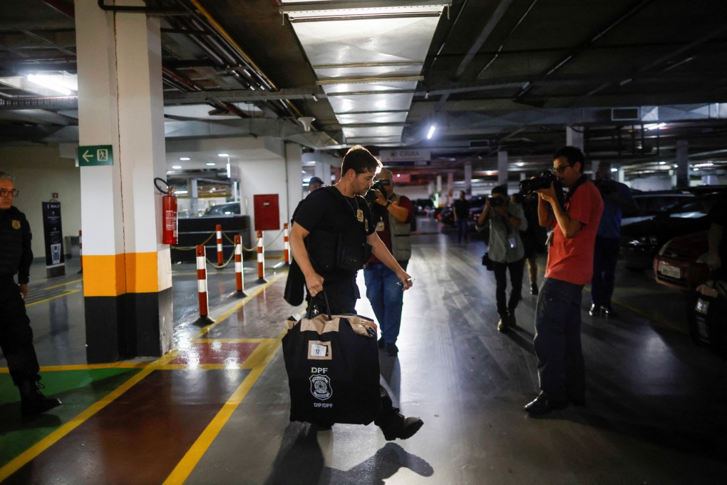 Federal police leave the headquarters of the Liberal Party during an operation targeting some of former president Jair Bolsonaro’s top aides in Brasilia, Brazil on Thursday. Photo: Reuters