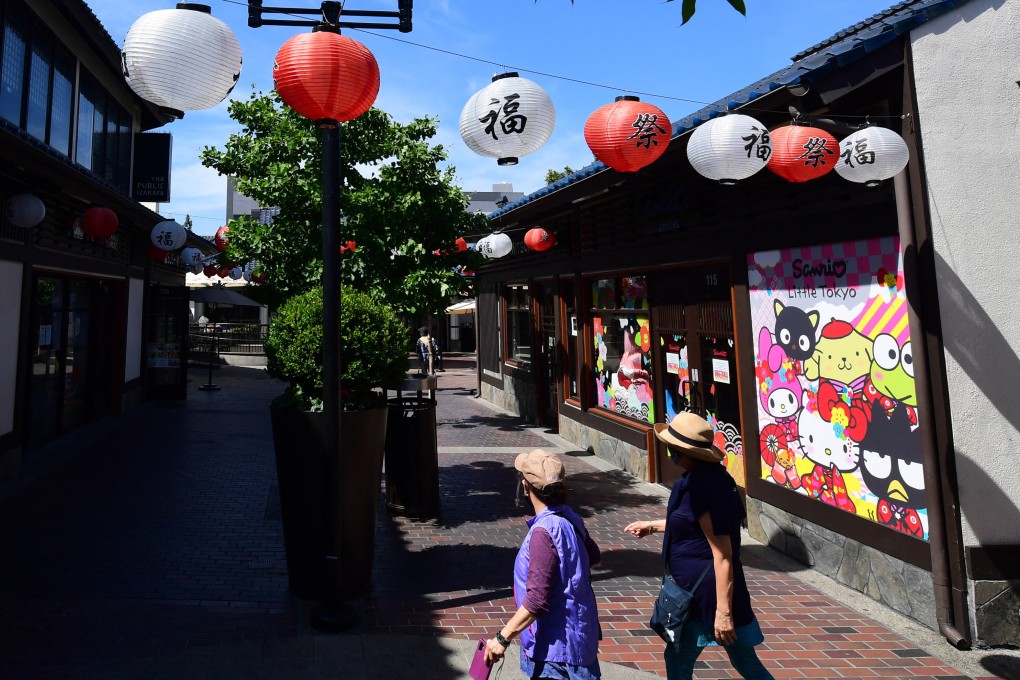 People walk by Little Tokyo in Los Angeles, US, on May 7, 2020. Photo: AFP