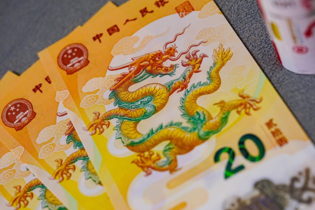 The People’s Bank of China unveiled a set of special gold, silver and copper alloy coins in December, alongside a 20-yuan banknote, to usher in the year of the dragon. Photo: Weibo