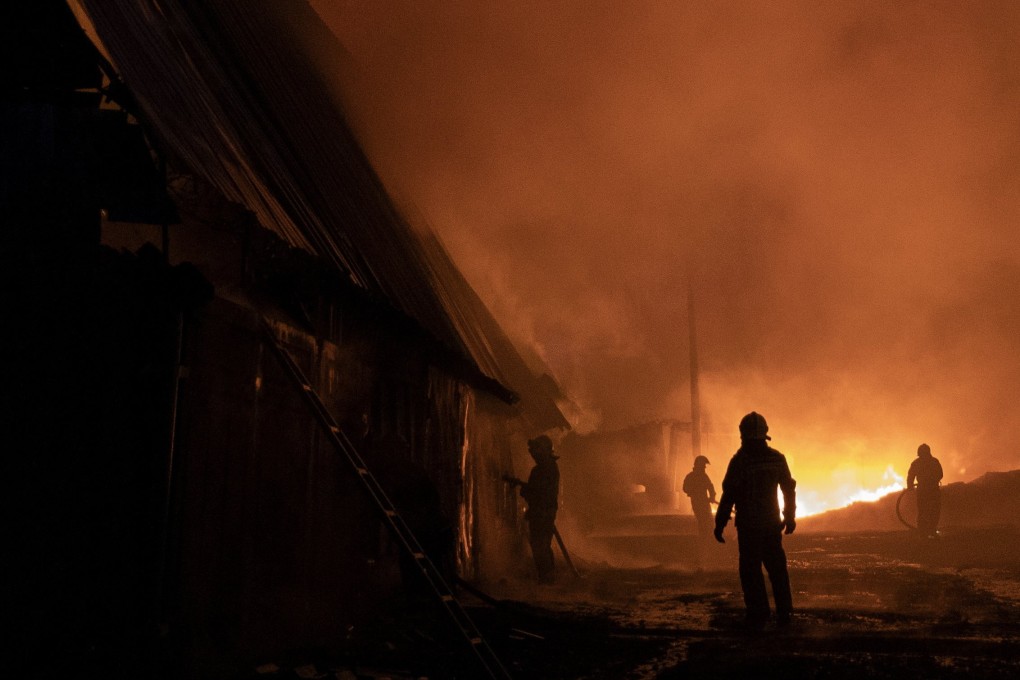 Rescue services work at the scene of a drone strike in the Ukrainian city of Kharkiv on Saturday. Photo: EPA-EFE